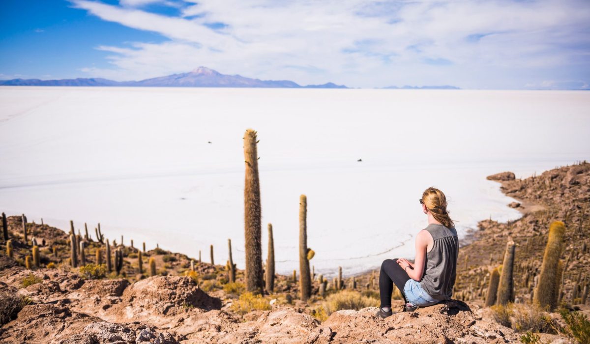 Tourist on cactus covered Fish Island (Isla Incahuasi or Inka Wasi), Uyuni Salt Flats (Salar de Uyun